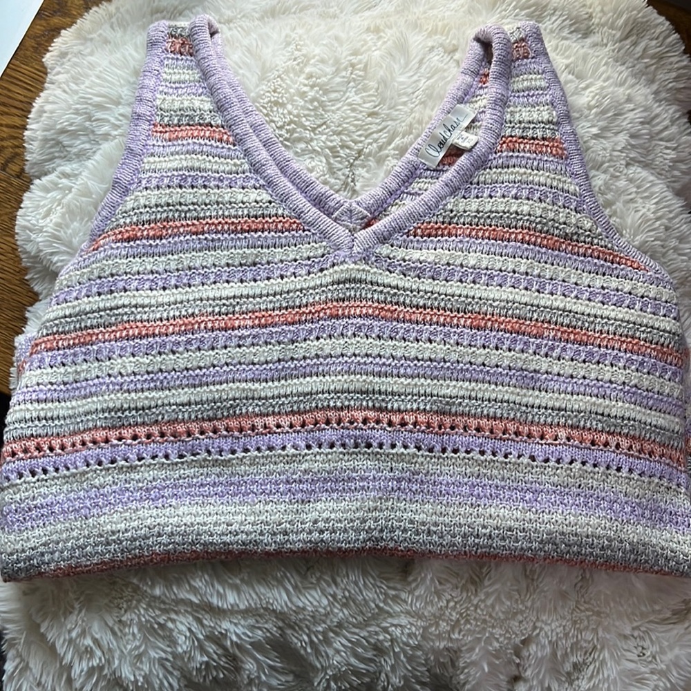 Purple, orange and grey striped sweater vest w/ a V cut neck.